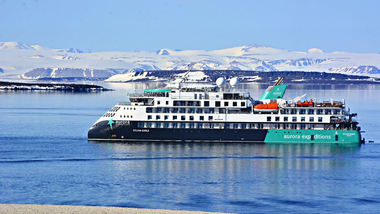 Aurora Expeditions guests sea kayaking between Antarctic icebergs