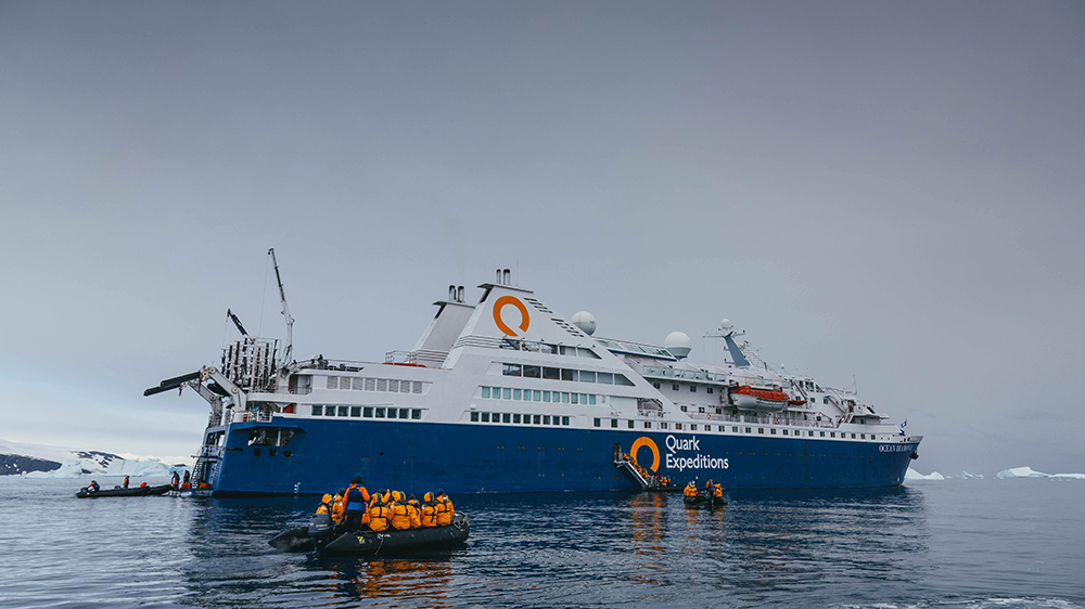 Quark Expeditions Ultramarine expedition ship in Antarctic waters with helicopter pad